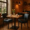 Super-Seat | Hospitality set Lisa black with castle oak table | Chaises en métal noir, table en mélamine de chêne, ambiance chaleureuse, tulipes jaunes. | Mobilier de restauration